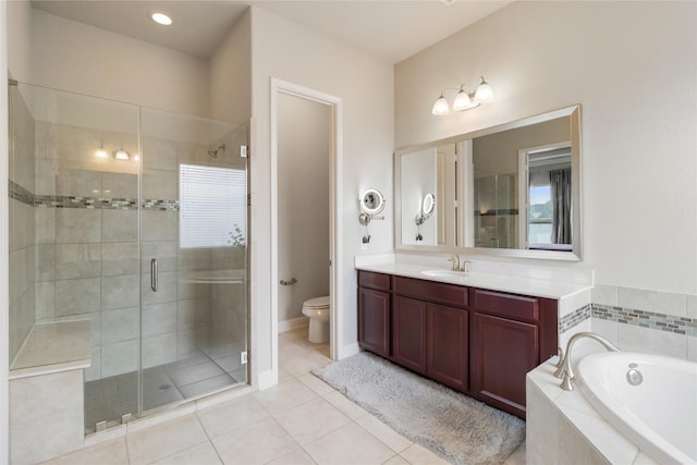 9612 Eden Ridge Ln, Pearland, TX 77584 - bathroom with a stall shower, toilet, a bath, vanity, and tile patterned floors