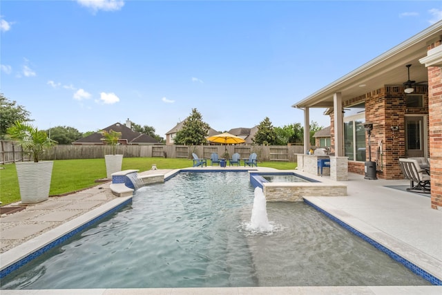 9612 Eden Ridge Ln, Pearland, TX 77584 - view of swimming pool featuring a pool with connected hot tub, a patio, and exterior kitchen