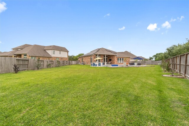 9612 Eden Ridge Ln, Pearland, TX 77584 - view of yard with a patio