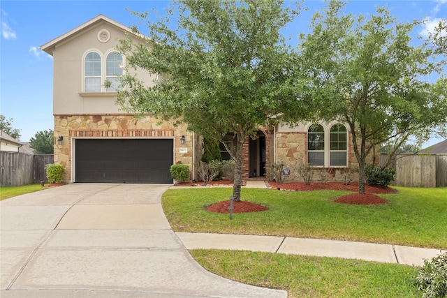 9612 Eden Ridge Ln, Pearland, TX 77584 - view of front facade with stone siding, a garage, concrete driveway, and stucco siding