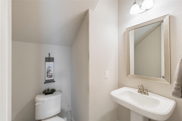 9612 Eden Ridge Ln, Pearland, TX 77584 - half bath with toilet, a sink, and lofted ceiling