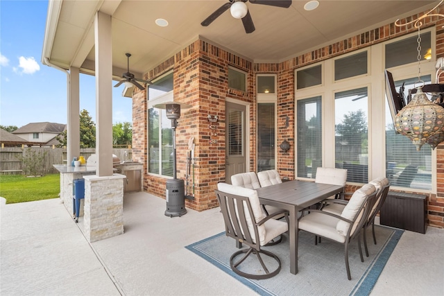 9612 Eden Ridge Ln, Pearland, TX 77584 - view of patio / terrace featuring an outdoor kitchen, a ceiling fan, fence, and outdoor dining space