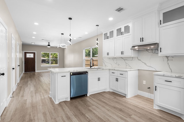 102 Schade Ln, Houston, TX 77037 - kitchen featuring dishwasher, a sink, a peninsula, plenty of natural light, and recessed lighting