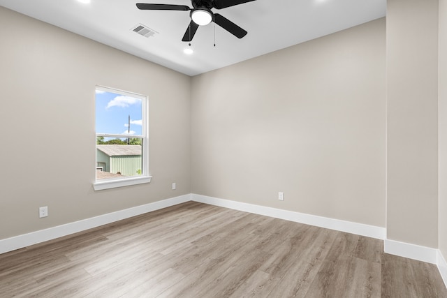 102 Schade Ln, Houston, TX 77037 - spare room with wood finished floors, ceiling fan, recessed lighting, and baseboards