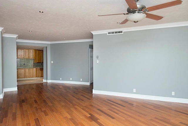 5050 Woodway Dr Unit 2A, Houston, TX 77056 - unfurnished living room featuring ceiling fan, wood finished floors, baseboards, ornamental molding, and a textured ceiling