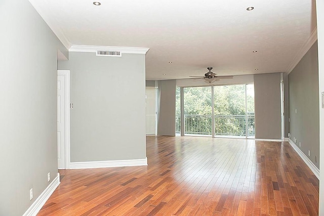 5050 Woodway Dr Unit 2A, Houston, TX 77056 - unfurnished room featuring a ceiling fan, wood-type flooring, ornamental molding, and baseboards