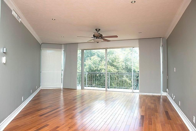 5050 Woodway Dr Unit 2A, Houston, TX 77056 - empty room featuring ceiling fan, wood-type flooring, ornamental molding, baseboards, and a textured ceiling
