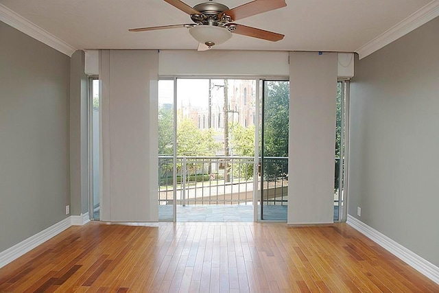 5050 Woodway Dr Unit 2A, Houston, TX 77056 - unfurnished room featuring hardwood / wood-style flooring, crown molding, a ceiling fan, and baseboards