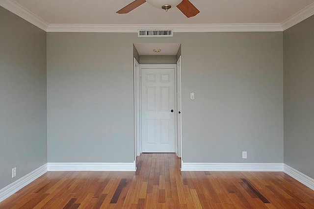 5050 Woodway Dr Unit 2A, Houston, TX 77056 - spare room featuring wood finished floors, baseboards, a ceiling fan, and crown molding