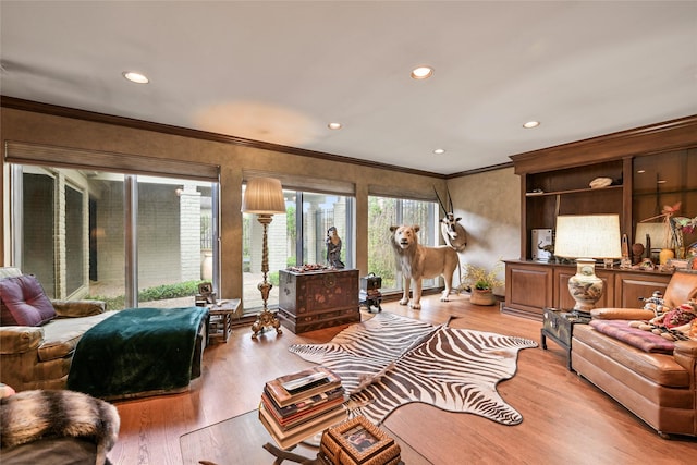 435 Flint Point Dr, Houston, TX 77024 - living area featuring light wood-style floors, crown molding, and recessed lighting