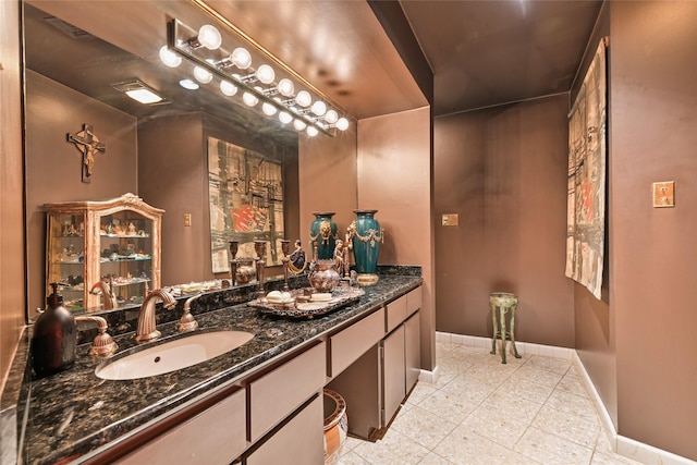 435 Flint Point Dr, Houston, TX 77024 - bathroom with baseboards, tile patterned floors, and vanity