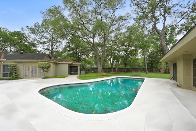 435 Flint Point Dr, Houston, TX 77024 - outdoor pool featuring french doors and a patio area