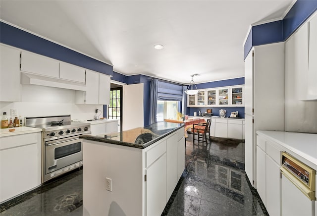 435 Flint Point Dr, Houston, TX 77024 - kitchen featuring high end stove, a center island, white cabinets, dishwashing machine, and an office area