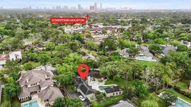 435 Flint Point Dr, Houston, TX 77024 - aerial view of residential area with a view of skyline and a pool area