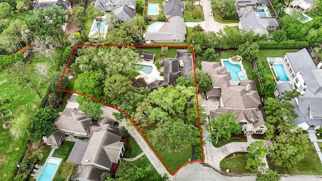 435 Flint Point Dr, Houston, TX 77024 - aerial perspective of suburban area with a pool and property parcel outlined
