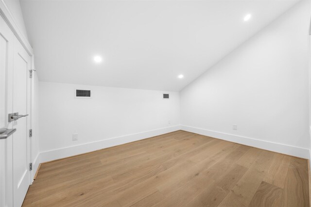 608 W Main St, Houston, TX 77006 - bonus room with lofted ceiling, baseboards, light wood-style floors, and recessed lighting