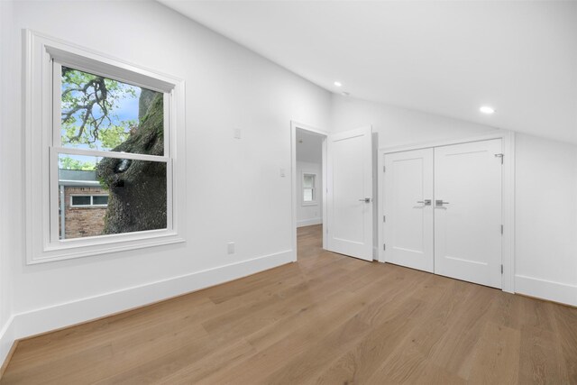 608 W Main St, Houston, TX 77006 - unfurnished bedroom featuring light wood-style flooring, vaulted ceiling, recessed lighting, baseboards, and a closet