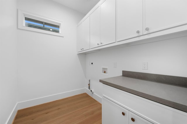 laundry room with cabinet space, light wood finished floors, washer hookup, gas dryer hookup, and electric dryer hookup