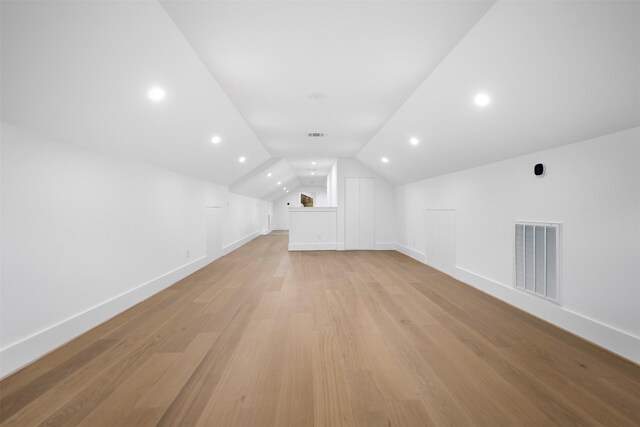 608 W Main St, Houston, TX 77006 - bonus room featuring light wood-type flooring, baseboards, lofted ceiling, and recessed lighting