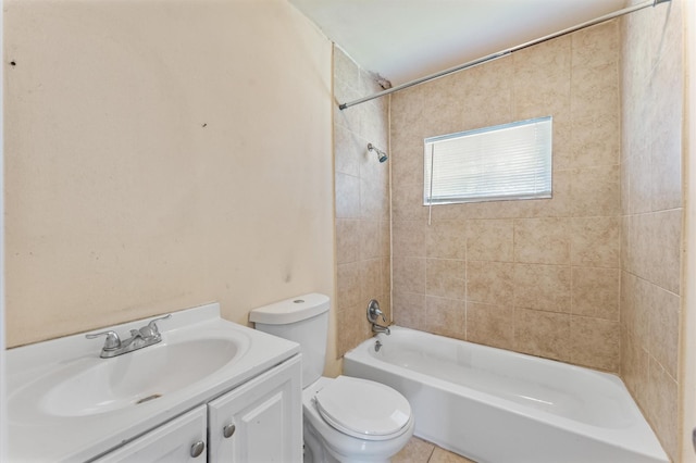 bathroom with toilet, vanity, and  shower combination