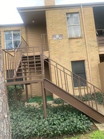 10555 Turtlewood Ct Unit 1601, Houston, TX 77072 - back of property with stairs and brick siding