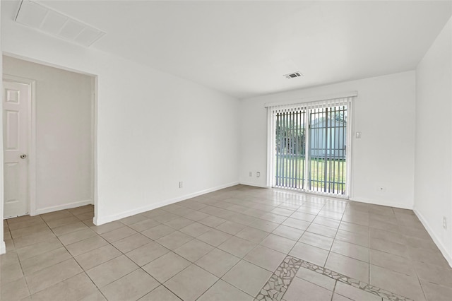9310 Woodlyn Rd, Houston, TX 77078 - empty room with light tile patterned flooring and baseboards