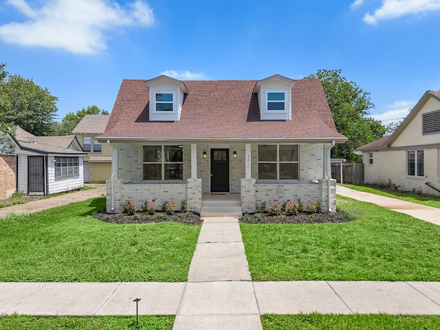 2811 Barbee St, Houston, TX 77004 - cape cod-style house with covered porch, brick siding, and a front yard