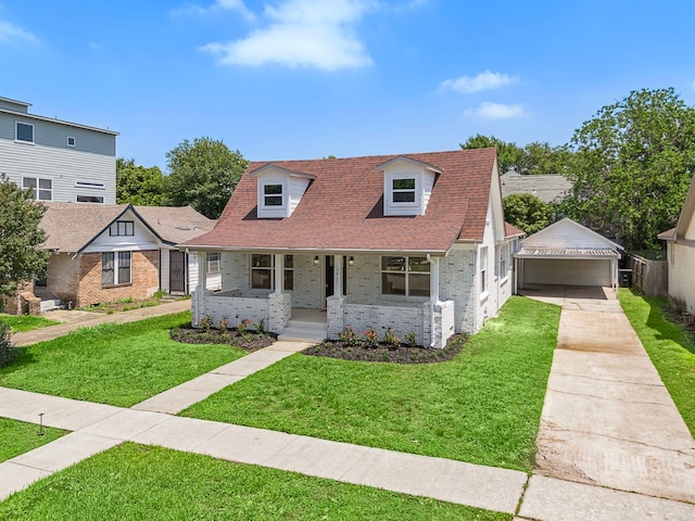 cape cod house with covered porch, brick siding, a front lawn, roof with shingles, and concrete driveway