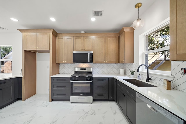 kitchen with stainless steel appliances, a sink, tasteful backsplash, light marble finish floors, and recessed lighting