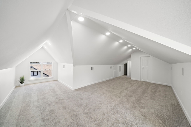 bonus room featuring carpet floors, lofted ceiling, baseboards, and recessed lighting