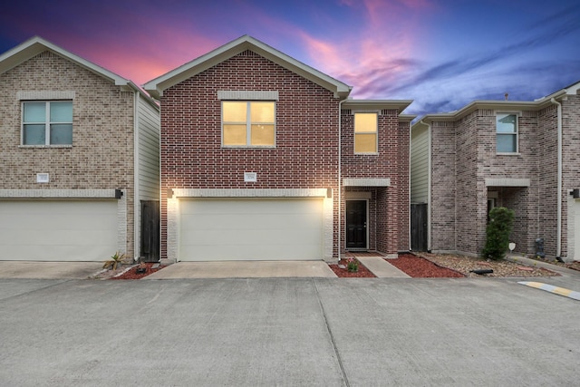 3718 Main Poplar Dr, Houston, TX 77025 - traditional-style house featuring driveway, a garage, and brick siding