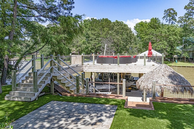 470 S Lakeview Dr, Point Blank, TX 77364 - rear view of property featuring stairway, a deck, a patio area, view of scattered trees, and a lawn