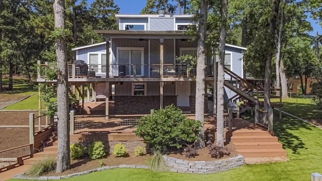 470 S Lakeview Dr, Point Blank, TX 77364 - rear view of house with stairway, a deck, and a lawn