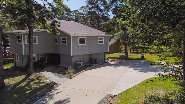 470 S Lakeview Dr, Point Blank, TX 77364 - view of side of property with concrete driveway and cooling unit