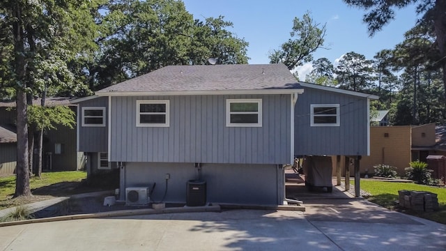 470 S Lakeview Dr, Point Blank, TX 77364 - view of front facade featuring a carport, driveway, a cooling unit, and roof with shingles