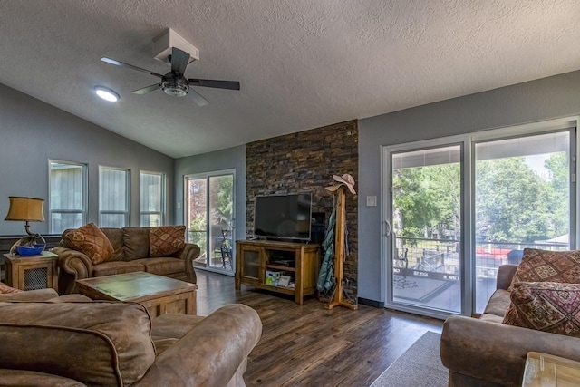 470 S Lakeview Dr, Point Blank, TX 77364 - living area featuring a textured ceiling, dark wood-type flooring, lofted ceiling, ceiling fan, and plenty of natural light