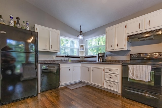 470 S Lakeview Dr, Point Blank, TX 77364 - kitchen with black appliances, a sink, under cabinet range hood, vaulted ceiling, and dark countertops