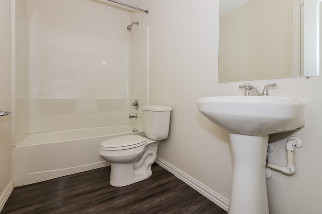 862 Rachel St, Houston, TX 77091 - full bathroom with toilet, washtub / shower combination, wood finished floors, and baseboards