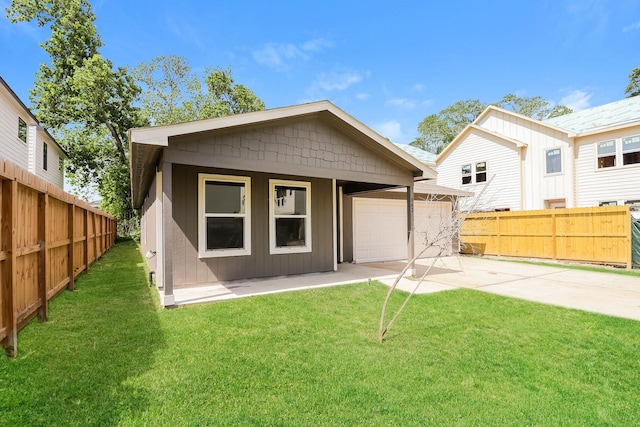 862 Rachel St, Houston, TX 77091 - rear view of house featuring a garage, board and batten siding, and concrete driveway