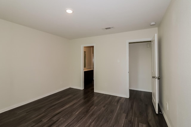 862 Rachel St, Houston, TX 77091 - unfurnished bedroom with dark wood-type flooring and baseboards