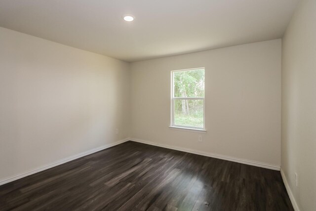 862 Rachel St, Houston, TX 77091 - unfurnished room featuring dark wood-type flooring, baseboards, and recessed lighting