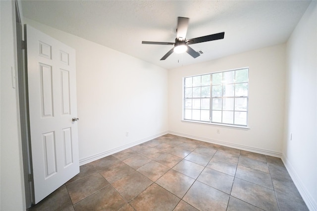 5006 Dawngate Dr, Spring, TX 77373 - unfurnished room with a ceiling fan, baseboards, and tile patterned floors