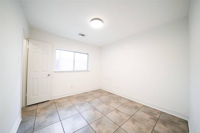 5006 Dawngate Dr, Spring, TX 77373 - empty room featuring light tile patterned floors and baseboards