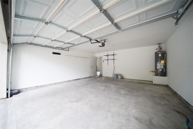 5006 Dawngate Dr, Spring, TX 77373 - garage featuring water heater and a garage door opener