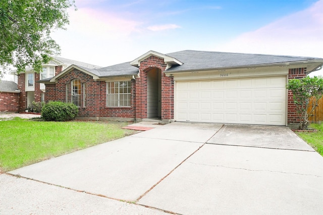 5006 Dawngate Dr, Spring, TX 77373 - ranch-style home with brick siding, concrete driveway, an attached garage, and a front lawn