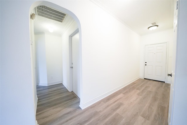 5006 Dawngate Dr, Spring, TX 77373 - hall featuring ornamental molding, light wood-style floors, arched walkways, and baseboards