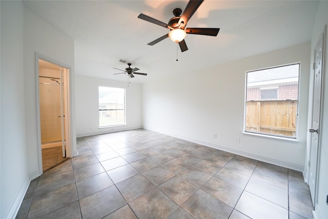 5006 Dawngate Dr, Spring, TX 77373 - unfurnished room featuring plenty of natural light, a ceiling fan, and tile patterned flooring