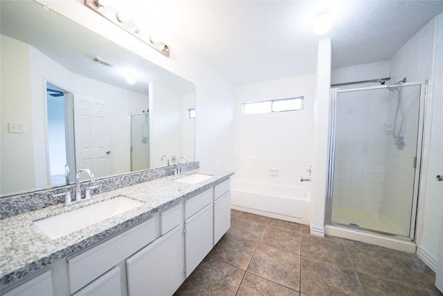 5006 Dawngate Dr, Spring, TX 77373 - bathroom featuring a stall shower, a garden tub, and double vanity