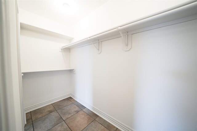 5006 Dawngate Dr, Spring, TX 77373 - spacious closet featuring tile patterned flooring