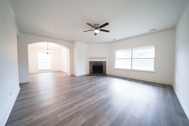 5006 Dawngate Dr, Spring, TX 77373 - unfurnished living room featuring ceiling fan, arched walkways, crown molding, a brick fireplace, and wood finished floors